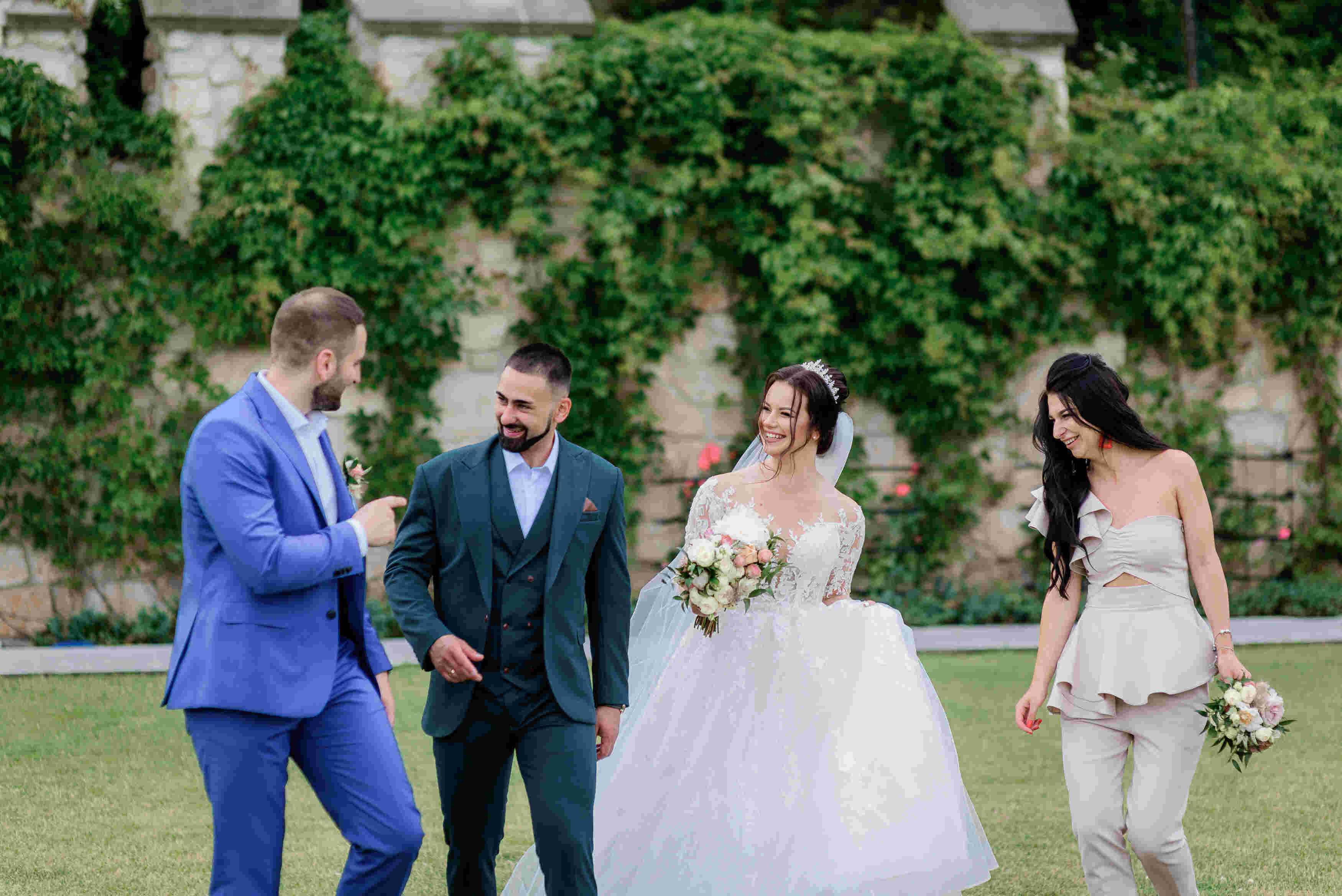 83981wedding-couple-with-best-friends-is-smiling-outdoors-near-stone-wall-covered-with-ivy-(1)20260813043433.jpg